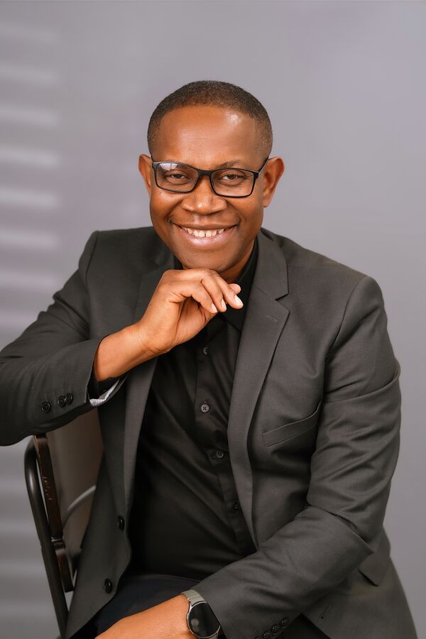 Chidi speaking on stage